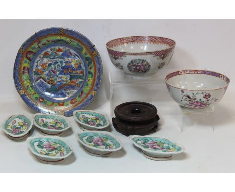 Two 18th century Chinese porcelain bowls, one with floral roundels, fish scale and lattice borders, 17.5cm diam., the other w