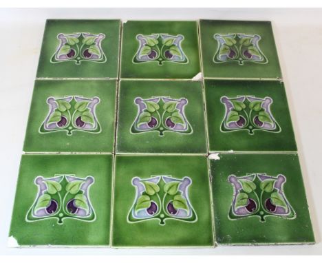 Collection of nine Art Nouveau tiles with foliate decoration in the Suffragette colours of green, white and violet, each 15.5