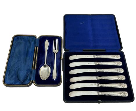A silver fork and spoon set by William Hutton &amp; Sons Ltd , Sheffield 1904. Together with a cased set of butter knives wit