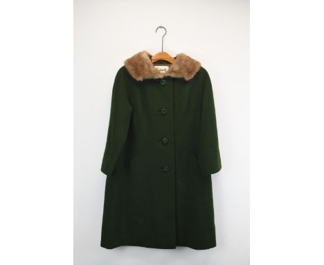 A vintage Harrod's army green women's winter coat with a mink fur collar. Label to interior. 
