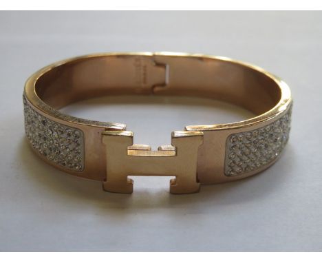 HERMES, PARIS CLIC H SNAP BANGLE SET WITH CLEAR STONES 