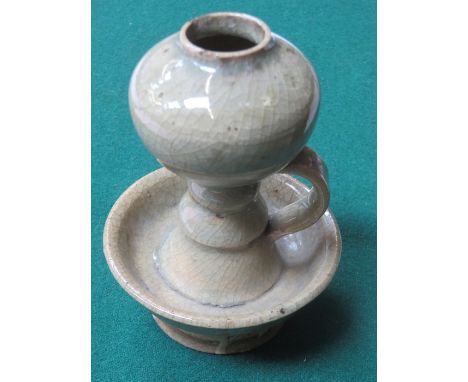 EARLY CRACKLE GLAZED POTTERY CHAMBER STICK, POSSIBLY ORIENTAL (AT FAULT), APPROXIMATELY 13cm HIGH 