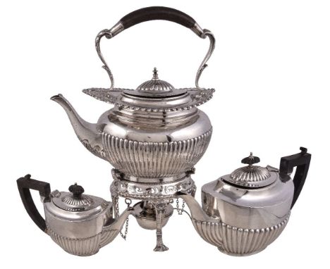 An Edwardian silver oval baluster kettle on stand by William Hutton & Sons Ltd., London 1902, the half lobed body with a comp