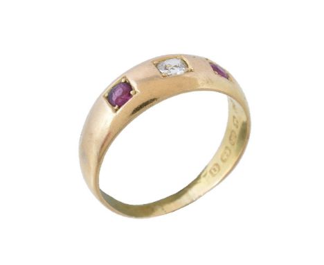 A Victorian 18 carat gold ruby and diamond ring, the central old cut diamond set between two circular rubies, stamped 18 with