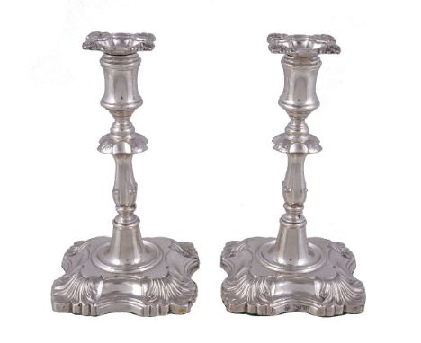 A pair of Edwardian silver taper sticks in early George III style by William Hutton & Sons Ltd., London 1902, 13cm (5in) high