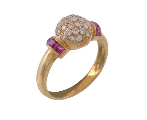 A ruby and diamond bombe ring, set with a central cluster of brilliant cut diamonds, approximately 0.40 carats total, between