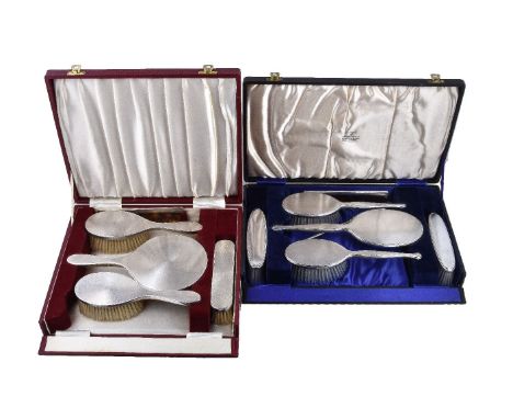 ϒ A cased matched silver mounted dressing table set, maker's mark D C Bs, London 1952 1959, 1956 and 1969 (2), comprising thr