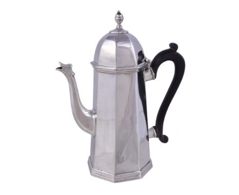A silver octagonal tapered coffee pot by D & J Welby, London 1896, with an octagonal finial to the domed cover and a composit