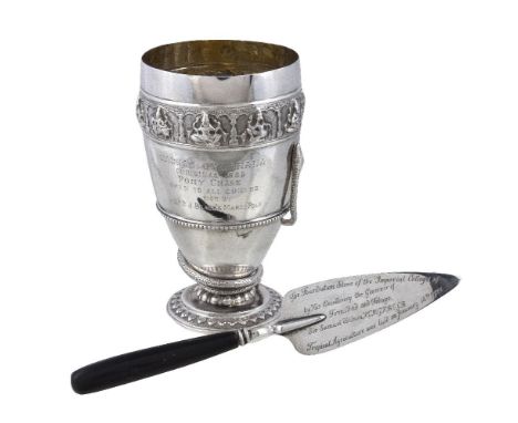 An Indian colonial silver presentation beaker, unmarked, Madras circa 1885, with a chased Swami band, an applied coiled snake