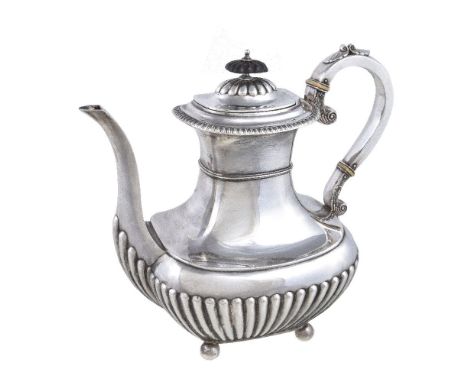 ϒAn Edwardian silver oblong baluster coffee pot by James Dixon & Son, Sheffield 1901, with a composition finial, a scroll han