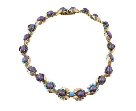 A 1960s paste set necklace by Christian Dior, the articulated panels set with vari coloured paste, within textured surrounds,