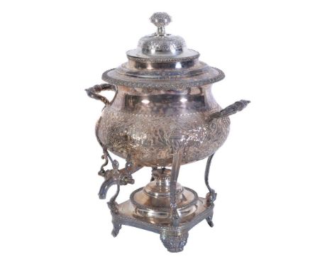 An electro-plated baluster tea urn, the associated domed lid with a chased foliate finial, twin foliate loop handles, the hal