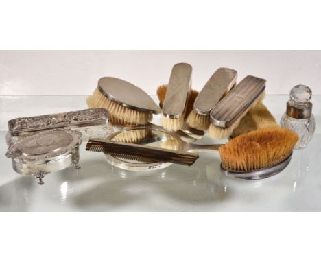 ϒA collection of silver mounted dressing table items, to include: a four piece silver mounted dressing table set, maker's mar