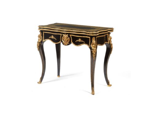 A Napoleon III card table, Ebonised wood, Yellow metal marquetry decoration, Gilt and chiselled foliage motifs, mask and fema