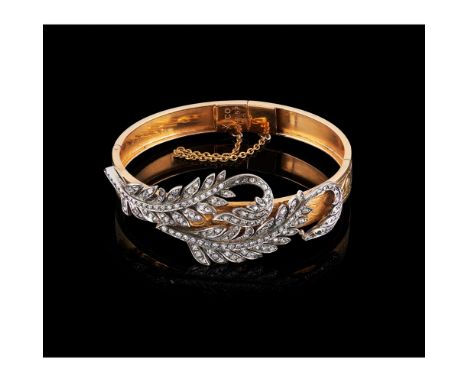 A bangle, Gold 800/000 and silver 833/000, Chiselled decoration, Set with rose cut diamonds and 42 8/8 cut diamonds totalling