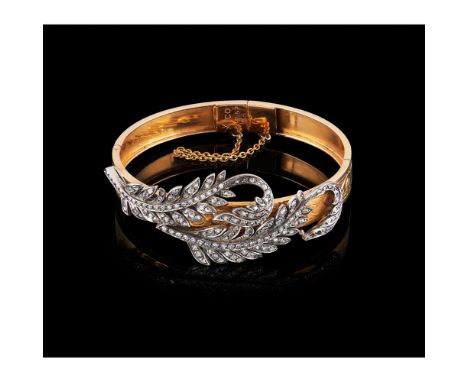 A bangle, Gold 800/000 and silver 833/000, Chiselled decoration, Set with rose cut diamonds and 42 8/8 cut diamonds totalling