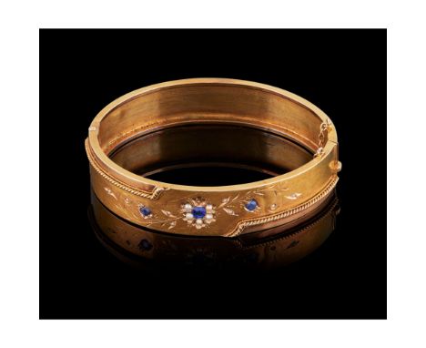 A bangle, Gold, Chiselled decoration, Set with demi-pearls and three sapphires, Oporto hallmark (1887-1937), (one demi pearl 