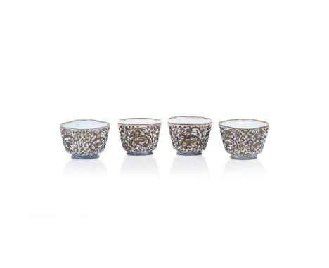 A set of four small lobate cups, Canton enamel, Black and gilt decoration on white ground depicting Chilong dragon and foliag