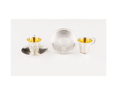 A pair of cups and saucers, Silver 950/000, Guilloche and monogrammed cartouches decoration, Assay warrantee mark, (signs of 