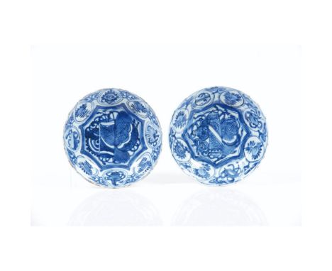 A pair of saucers, Chinese export porcelain, Blue underglaze decoration of floral motifs and Buddhist symbols, Ming dynasty, 