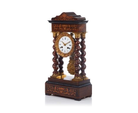 A Louis-Philippe table top clock, Rosewood veneered of thorn bush inlays, Enamelled dial of Roman numbering, bronze applied e