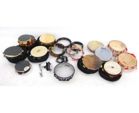 Quantity of various tambourines including a pearl mounted tambourine with mesh head, a Remo 10" Glenvelez Riq, a Remo Chorino