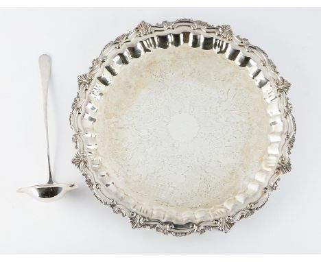 Large silver plated serving tray and Wallace ladle. The server rests on four legs and is decorated with an impressed foliate 