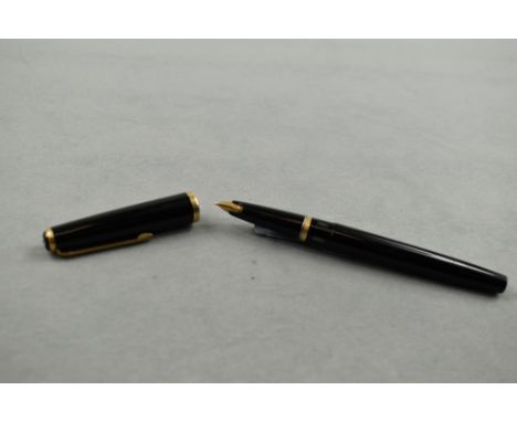 A Lamy 27 piston fill fountain pen in black having Lamy 14k nib. Approx 13.4cm