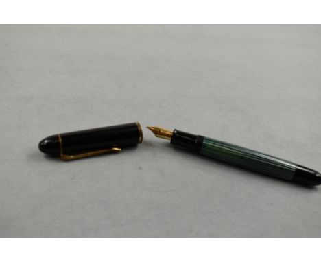 A Pelikan 120 piston fill fountain pen in green striated pattern and black cap having Parker Duofold nib. Approx 12.4cm