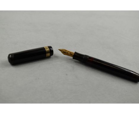 A Soennecken 120 piston fill fountain pen in black with three bands to the cap (clip missing) having Soennecken 14ct nib. App