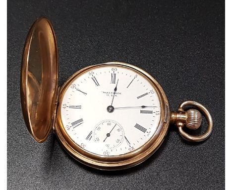 NINE CARAT GOLD CASED WALTHAM POCKET WATCHthe white enamel dial with Arabic numerals and subsidiary seconds dial, the movemen