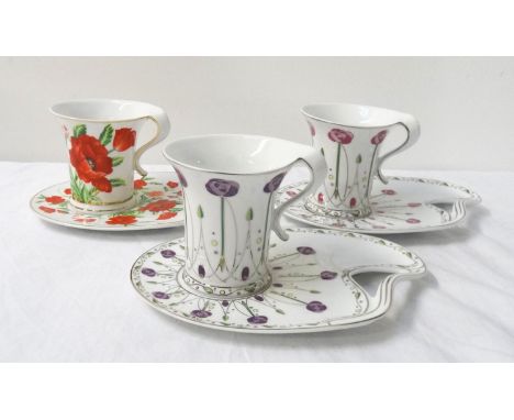 THE LEONARDO COLLECTIONthree new and boxed coffee cups and saucers all decorated with flowers and gilt borders 