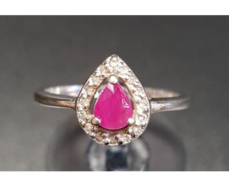 RUBY AND DIAMOND CLUSTER RINGthe central pear cut ruby in sixteen diamond surround, on nine carat white gold shank, ring size