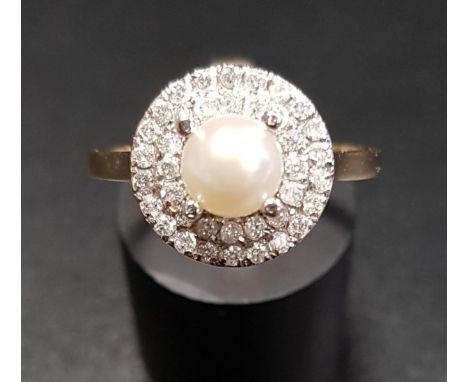 PEARL AND DIAMOND CLUSTER RINGthe central pearl in double diamond surround totalling approximately 0.4cts, on nine carat gold