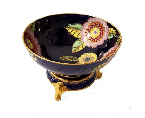 CARLTON WARE CENTRE BOWLdecorated in the Melange pattern with a navy blue ground and gilt highlights, 25cm diameter, on a mat