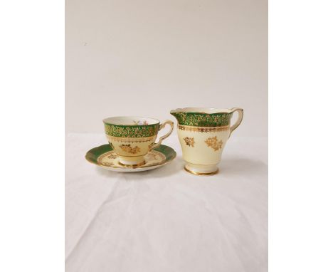 ROYAL STAFFORD PORCELAIN TEA SERVICEcomprising cups and saucers, side and sandwich plates, milk jug and tea bowl all decorate