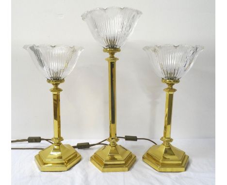 PAIR OF BRASS TABLE LAMP UPLIGHTERSraised on a hexagonal base and column to an inverted shaped and ribbed glass shade, togeth