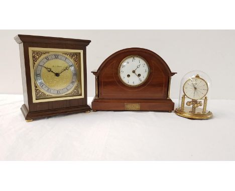 SHAPED MAHOGANY CASED MANTLE CLOCKthe circular dial with Arabic numerals, with a presentation plaque below; a Fox and Simpson