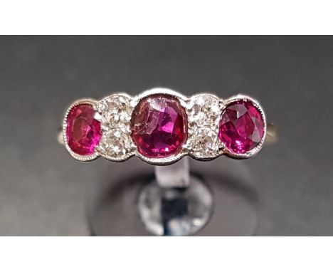 RUBY AND DIAMOND RINGthe three rubies separated by diamonds, on nine carat gold shank with platinum setting, ring size S 