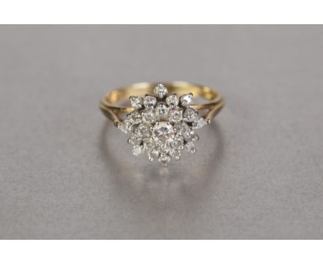 18ct GOLD AND DIAMOND DOMED CLUSTER RING OF FOUR FOUR TIERS, twenty three diamonds, the centre stone, approx 1/5ct, approx 1.