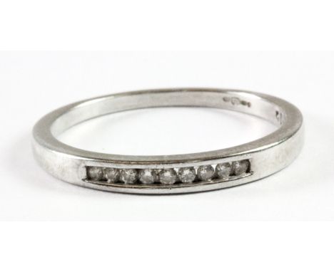 A 9ct white gold diamond set half eternity ring (N).