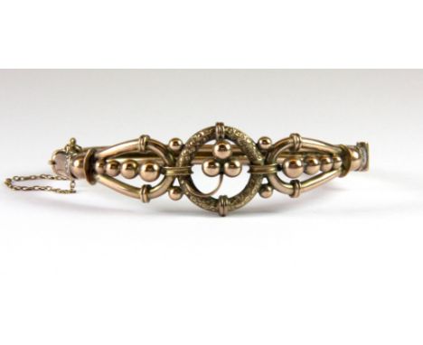 A Victorian 9ct rose gold (stamped 9ct) bangle, (approx. 9.7gr), L. 6.5cm.