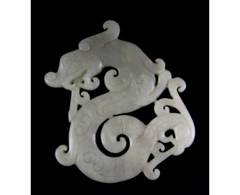 A Chinese carved mutton fat jade figure of a dragon. H.7.5cms