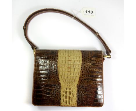 A vintage crocodile skin handbag.