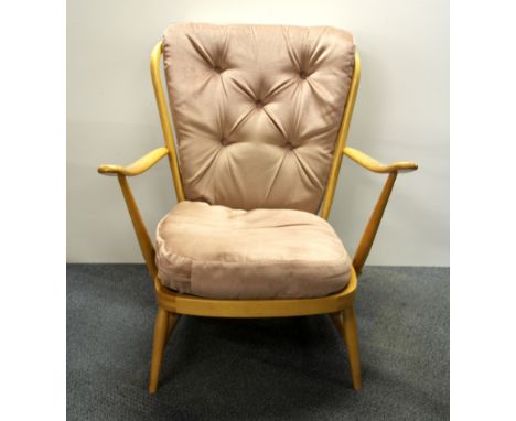 An Ercol cottage arm chair.