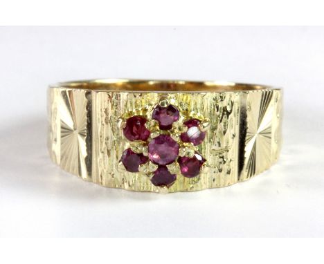 A 9ct yellow gold ruby cluster ring (Q.5).
