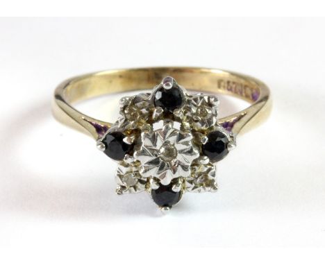 An antique 9ct yellow and white gold sapphire and diamond cluster ring (O).