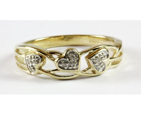 A 9ct yellow gold diamond set ring (M.5).