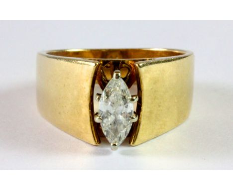 A heavy 14ct yellow gold ring set with a marquise cut diamond (N).