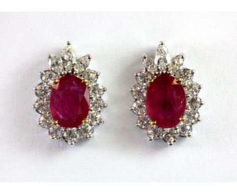 A pair of 18ct white gold ruby and diamond cluster earrings (untreated rubies approx. 2.6ct and 1.27ct diamonds), L. 1.5cm.